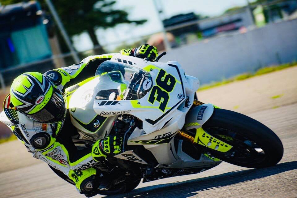 NFmoto rider on track in a custom leather race suit